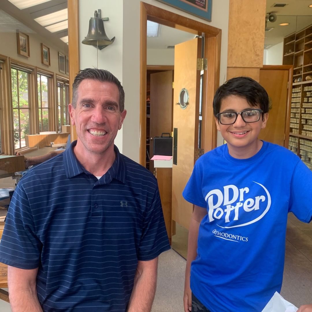 Dr. Potter and young boy smiling