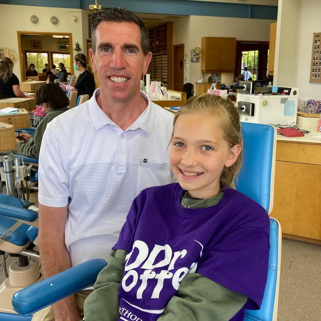 Dr. Potter and young girl smiling for the camera