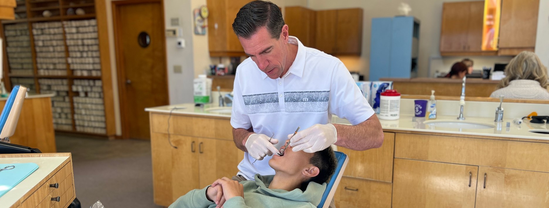 Dr. Potter examining patient's teeth